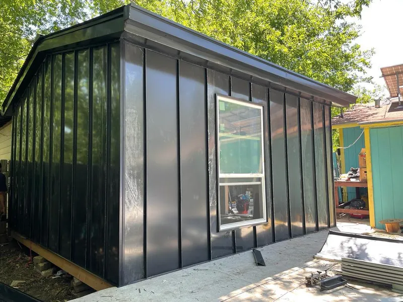 Black standing seam metal wall panels for Roof Inspection in DeSoto